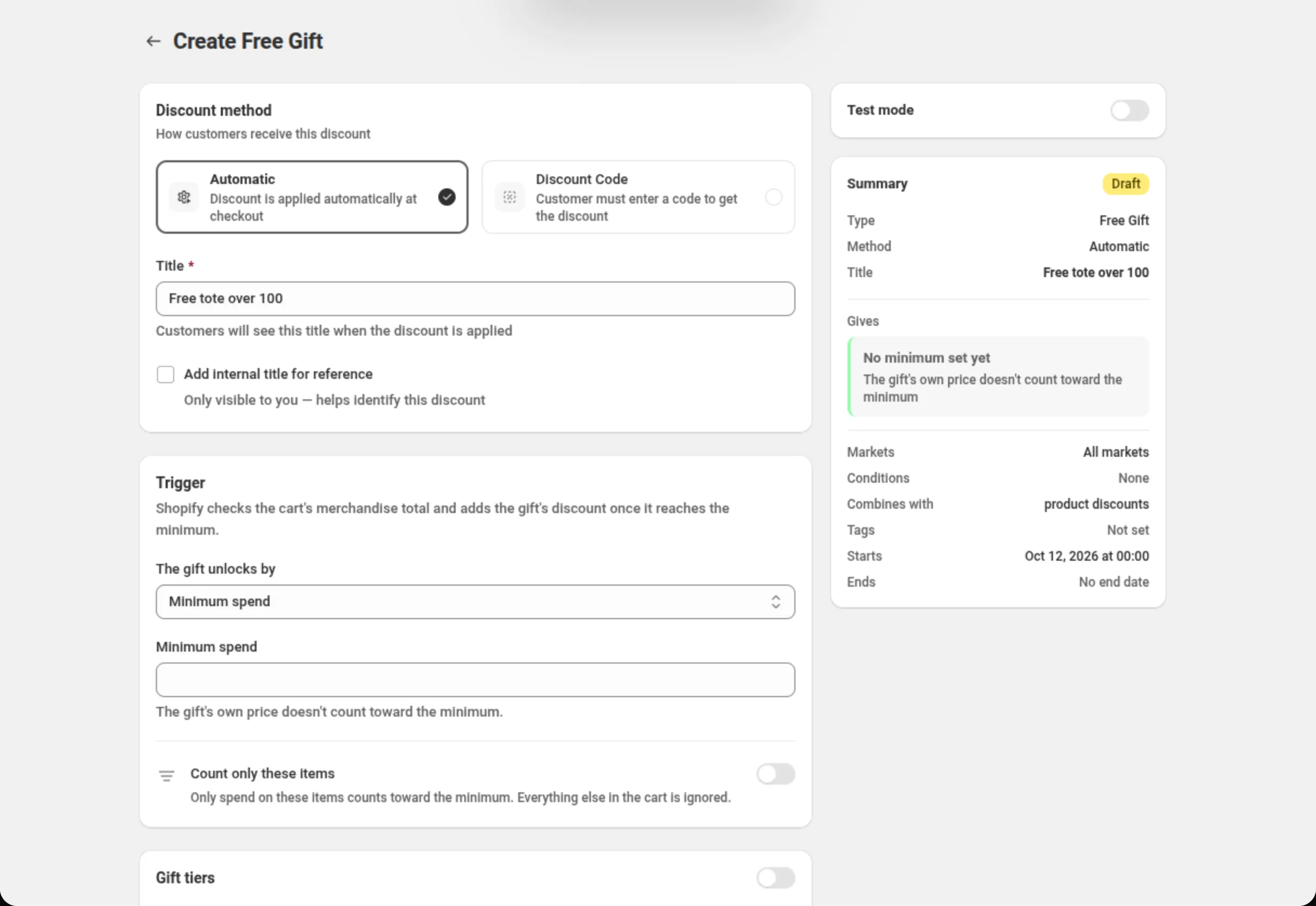 The Create Free Gift page with the Title field reading Free tote over 100, the Trigger card with The gift unlocks by set to Minimum spend, the Minimum spend field, the Count only these items switch, and a Summary card whose rows read No minimum set yet and Combines with product discounts. Above the Summary, the Test mode card, switched off
