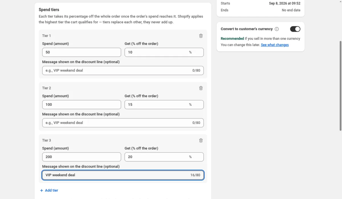 The Spend tiers card of a DiscountOS Spend More Save More discount, with the help text Shopify applies the highest tier the cart qualifies for, tiers replace each other, they never add up. Tier 1 has Spend (amount) 50 and Get (% off the order) 10, Tier 2 has 100 and 15, and Tier 3 has 200 and 20 with Message shown on the discount line reading VIP weekend deal. The Add tier link sits below. On the right, Convert to customer's currency is switched on.